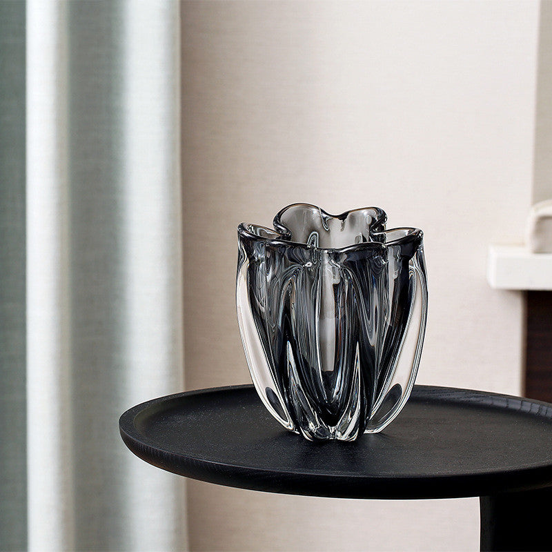 Medium organic shaped smoked glass vase on black table