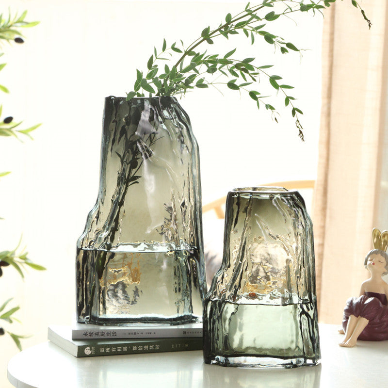 Smoky grey textured glass vases with botanical arrangement