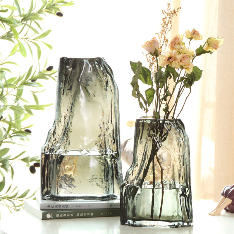 Two smoky grey glass vases on table setting