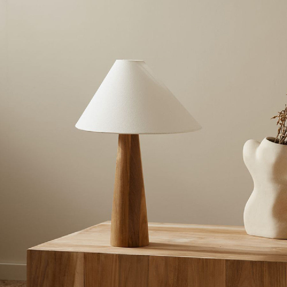 Front view of solid wood tapered base table lamp with white shade