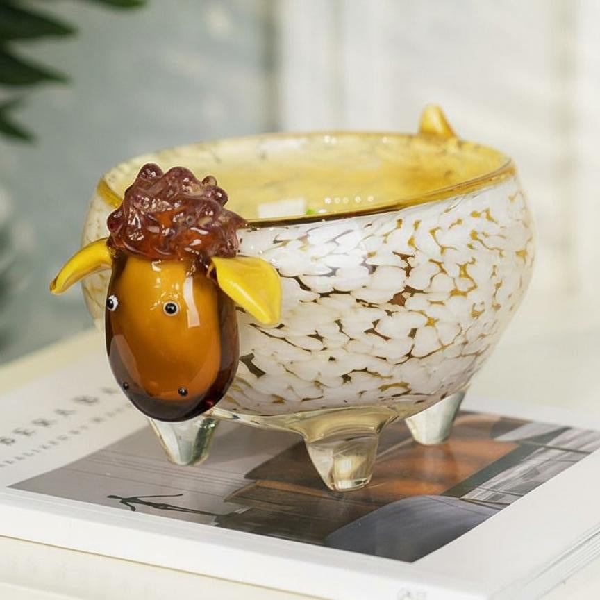 Side profile of amber speckled glass sheep bowl