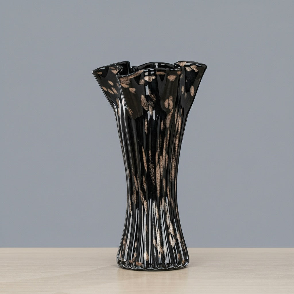 Black speckled art glass vase with wavy rim