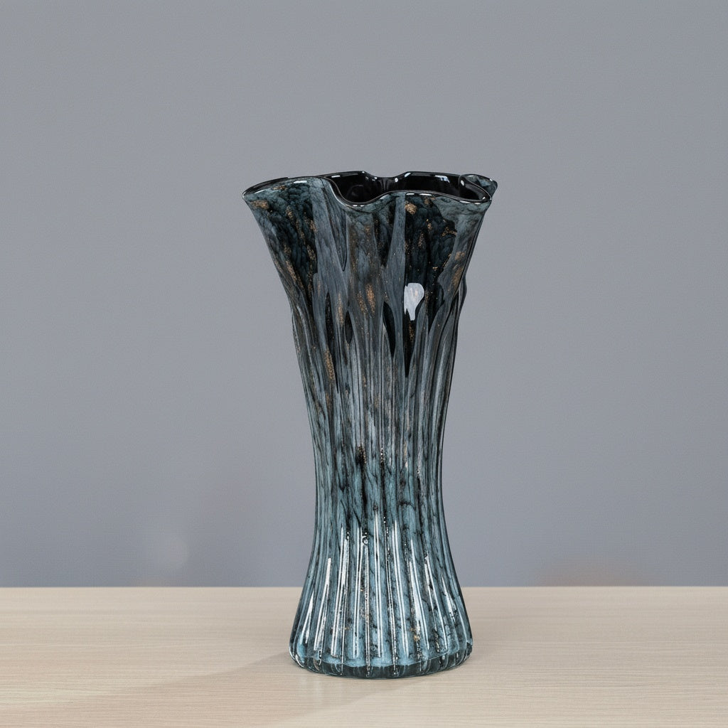 Blue speckled art glass vase with fluted body