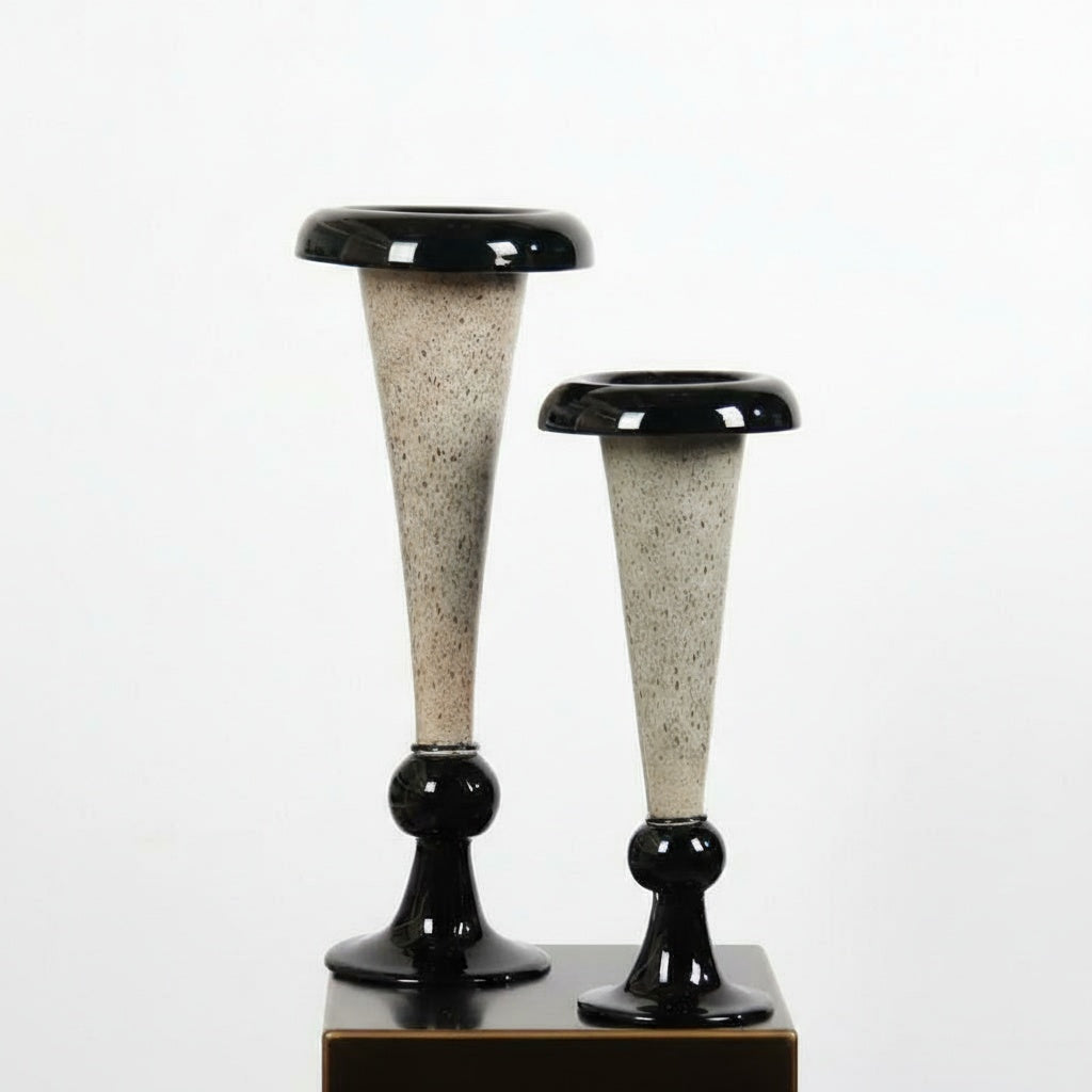 Group shot of large and medium speckled glass vases with black accents