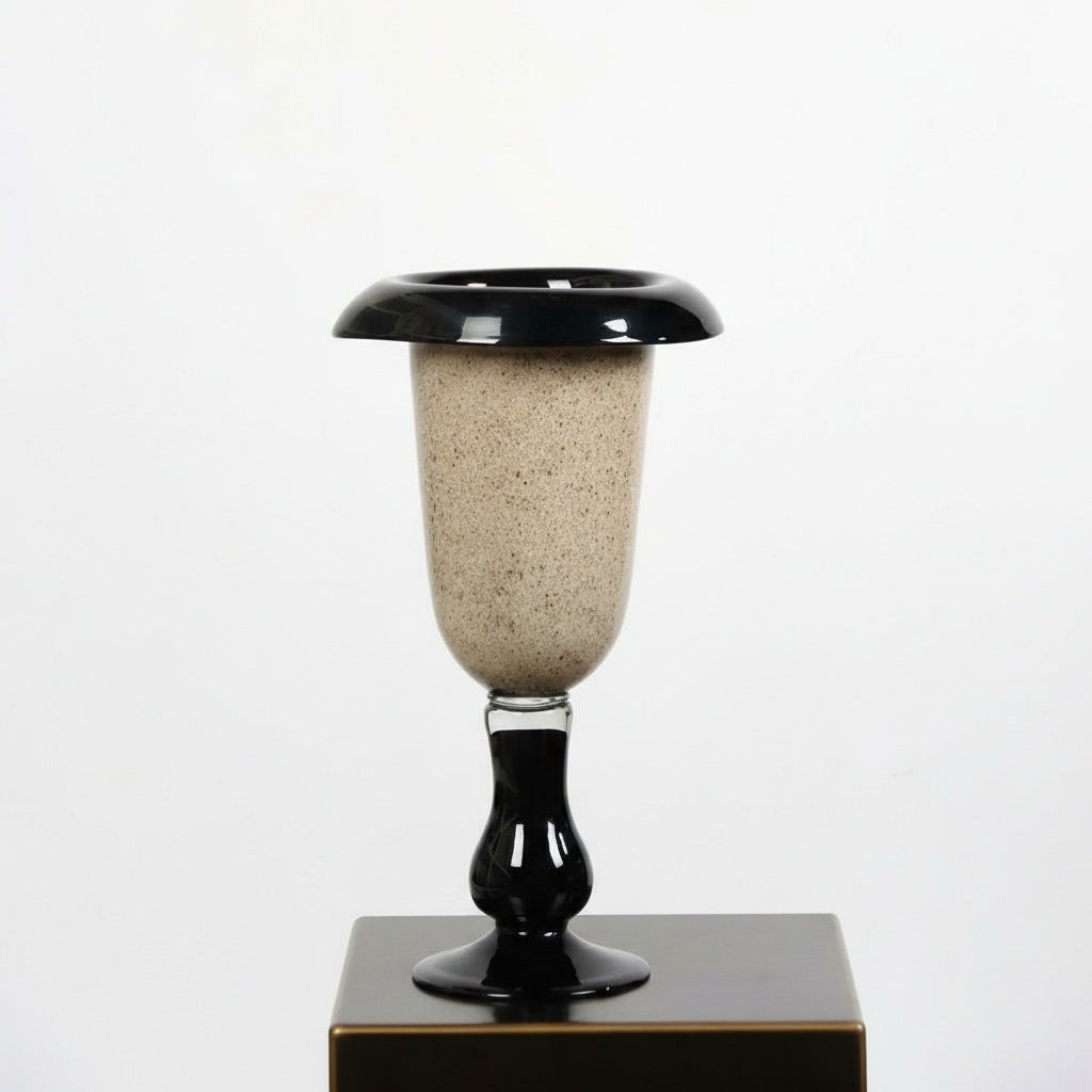 Medium speckled beige glass vase with black rim and base