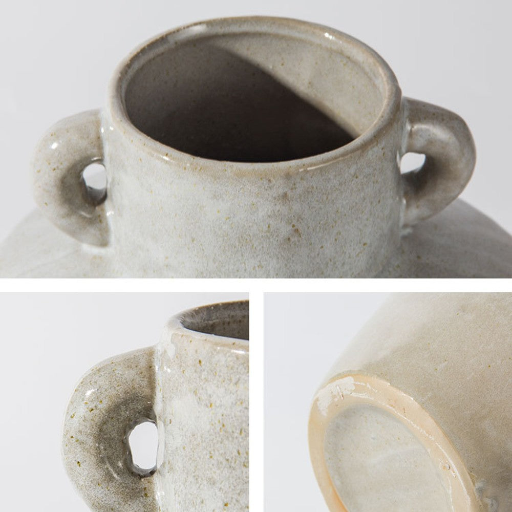 Close up of ceramic vase handle and speckled glaze texture handcrafted detail