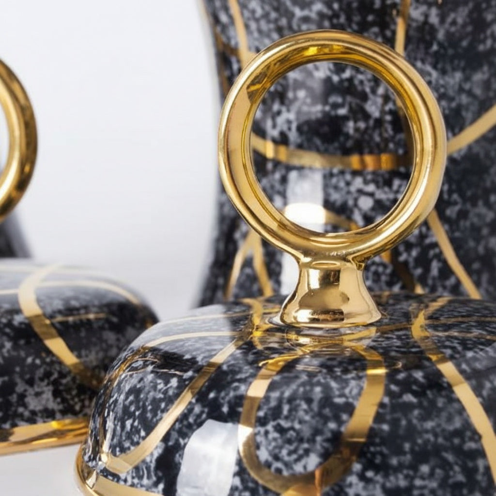Gold Ring Handle Detail On Speckled Ceramic Jar