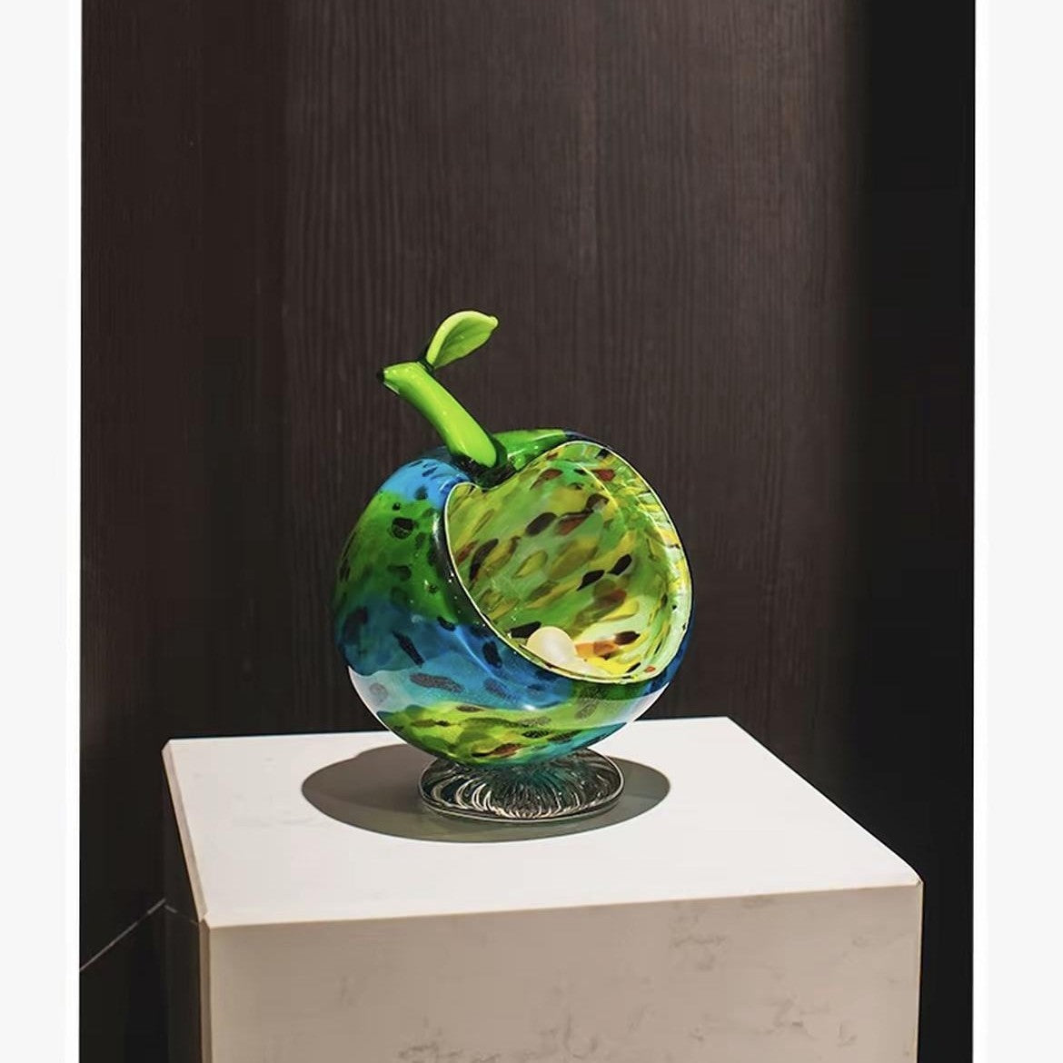 Art glass apple bowl on display pedestal