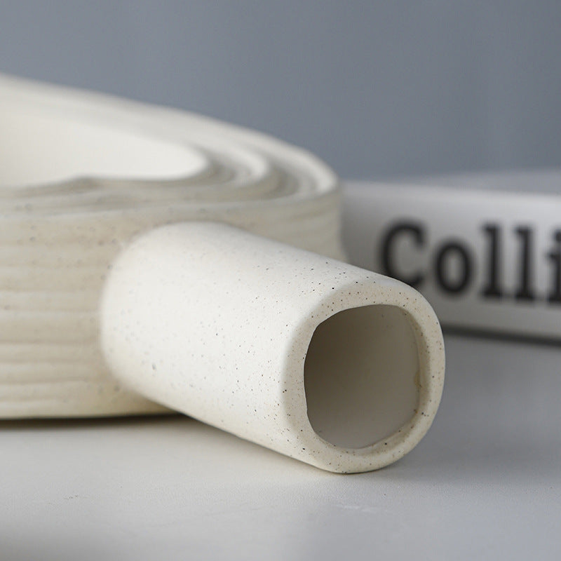 Close up detail of vase neck and speckled finish