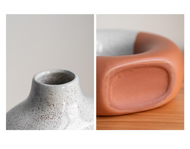 Close up detail of speckled glaze neck on ceramic vase