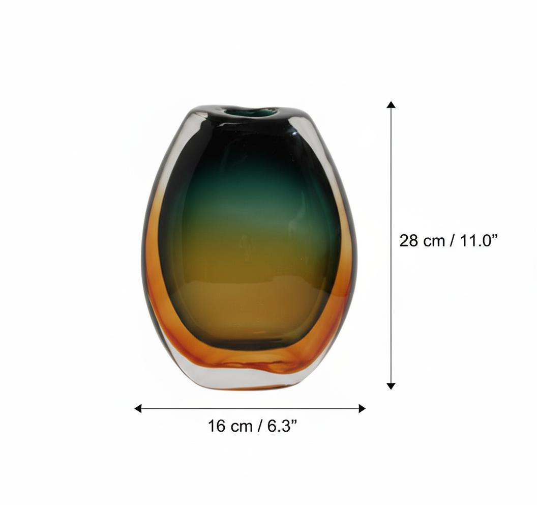 Angled view of teal and amber oval glass vase