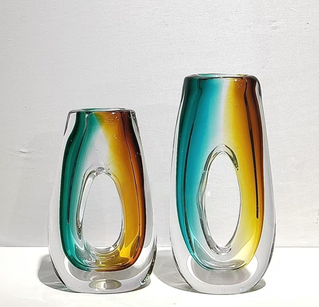 Set of two sculptural art glass vases in teal and amber