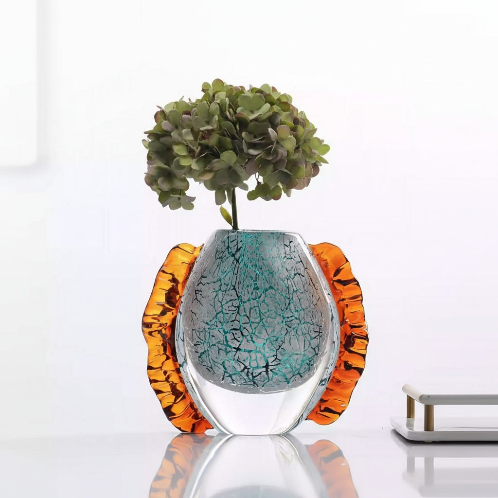 Close up of medium teal mosaic glass vase with amber wings