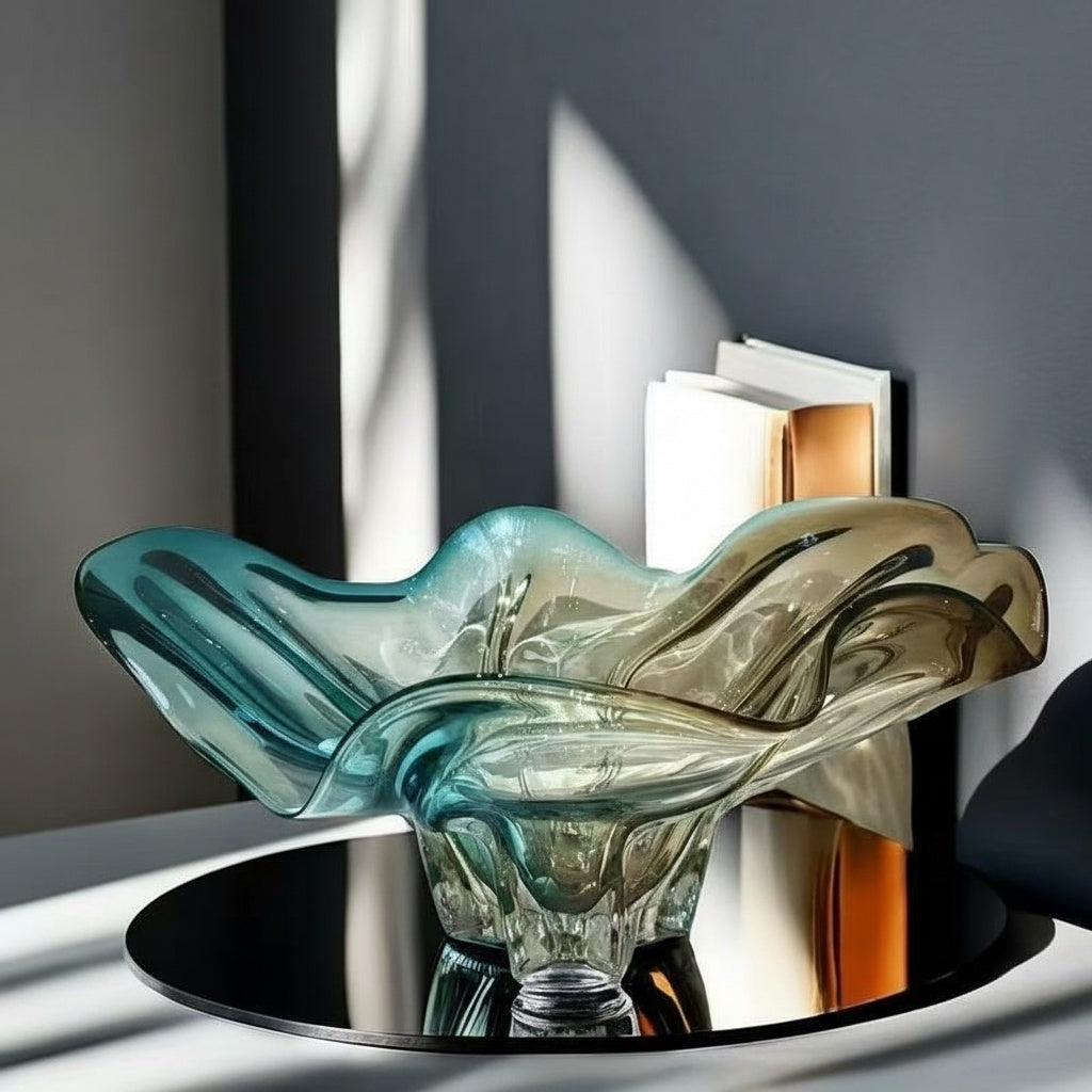 Side profile of teal and amber wavy glass bowl