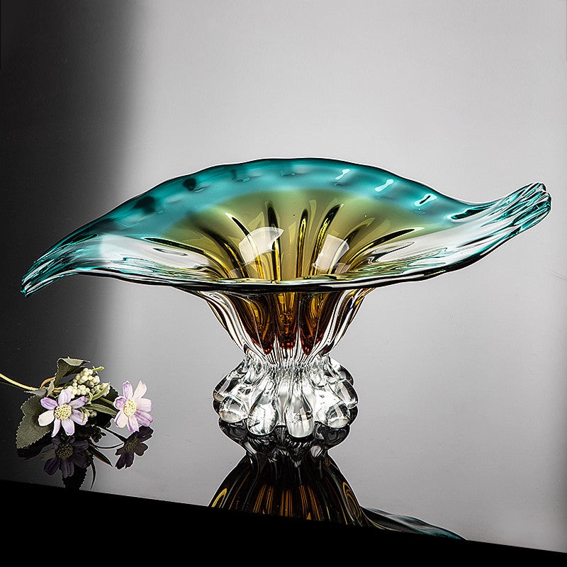 Empty gradient glass bowl on reflective surface