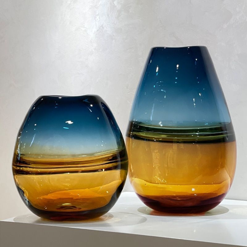 Two gradient glass vases side by side