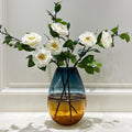 Large tall vase with white flowers front view