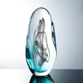 Front view of teal and clear art glass ovoid sculpture