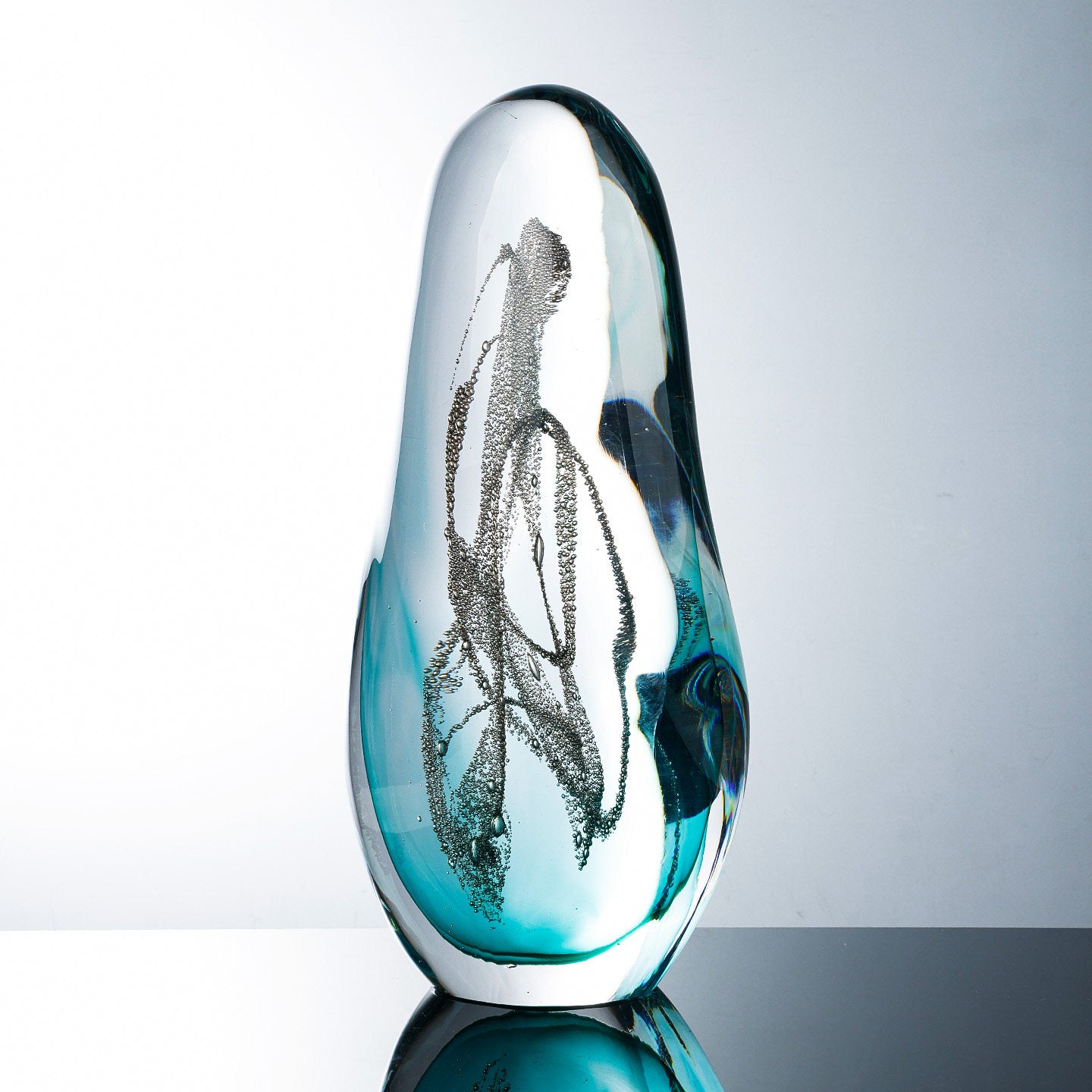 Detail view of the suspended bubble texture within the glass