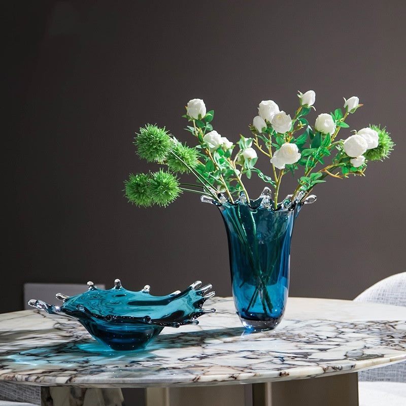 Teal splash vase with white roses and low bowl centerpiece