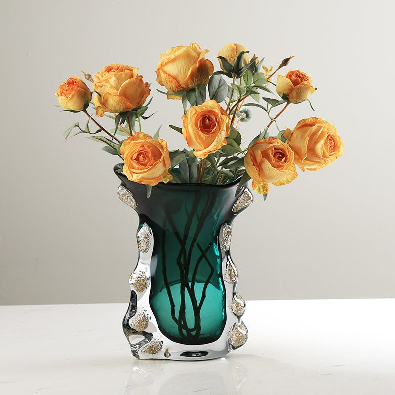 Teal art glass vase with orange roses