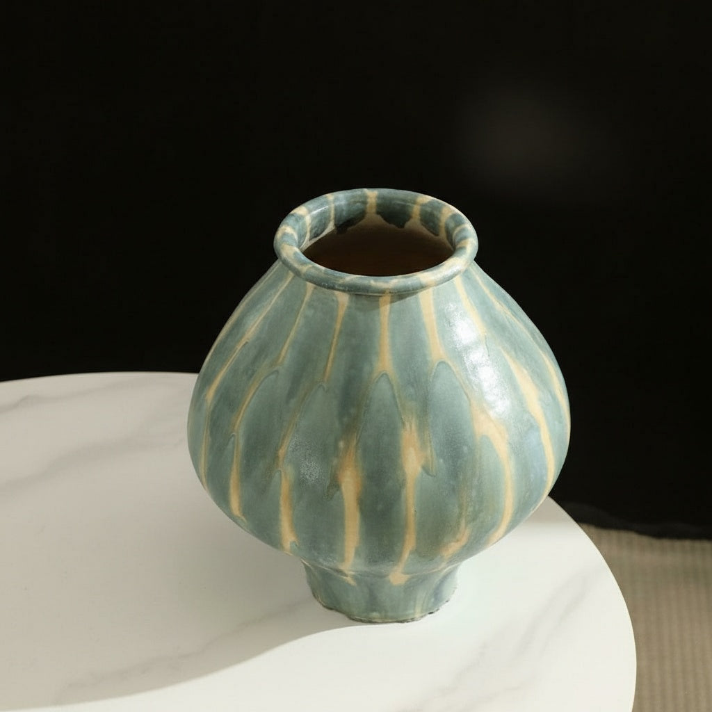High angle view of glazed ceramic vase showing rim details