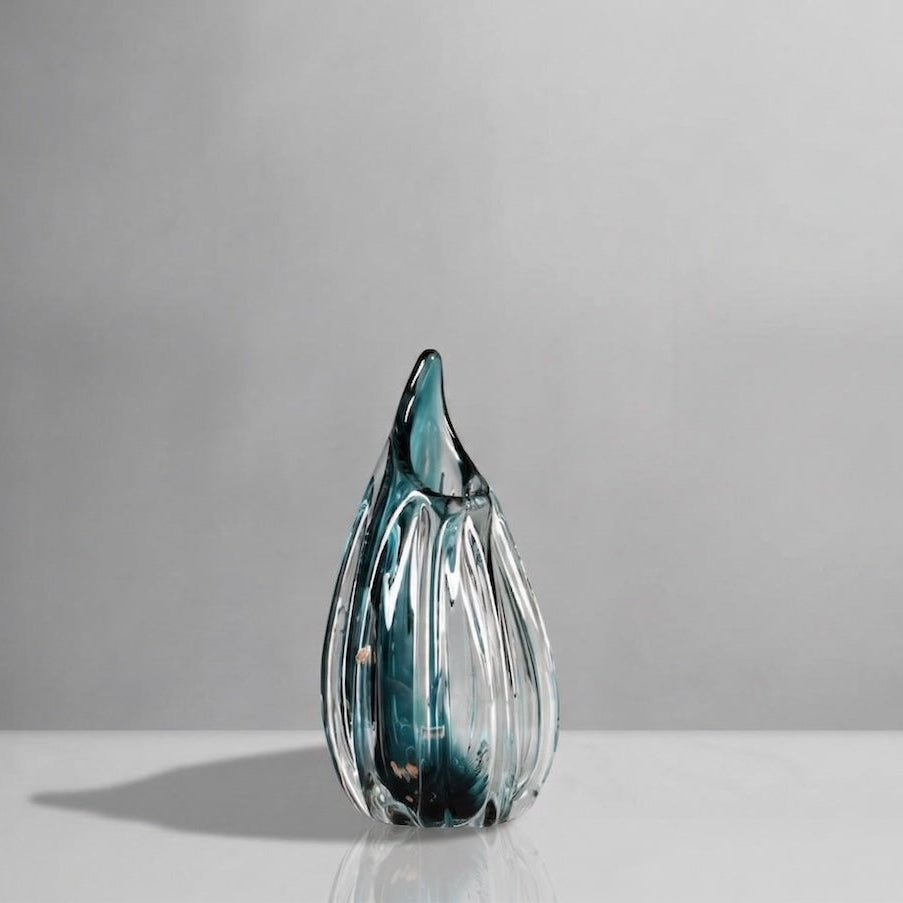 Glass vasse with blue and clear patterns on a gray background