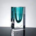 Front view of teal and clear glass block vase