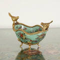 Teal crackle glazed ceramic bowl with brass bird mounts and floral design