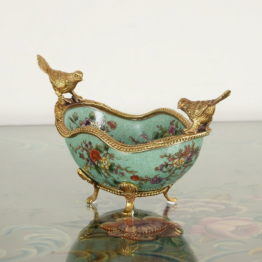 Teal crackle glazed ceramic bowl with brass bird mounts and floral design