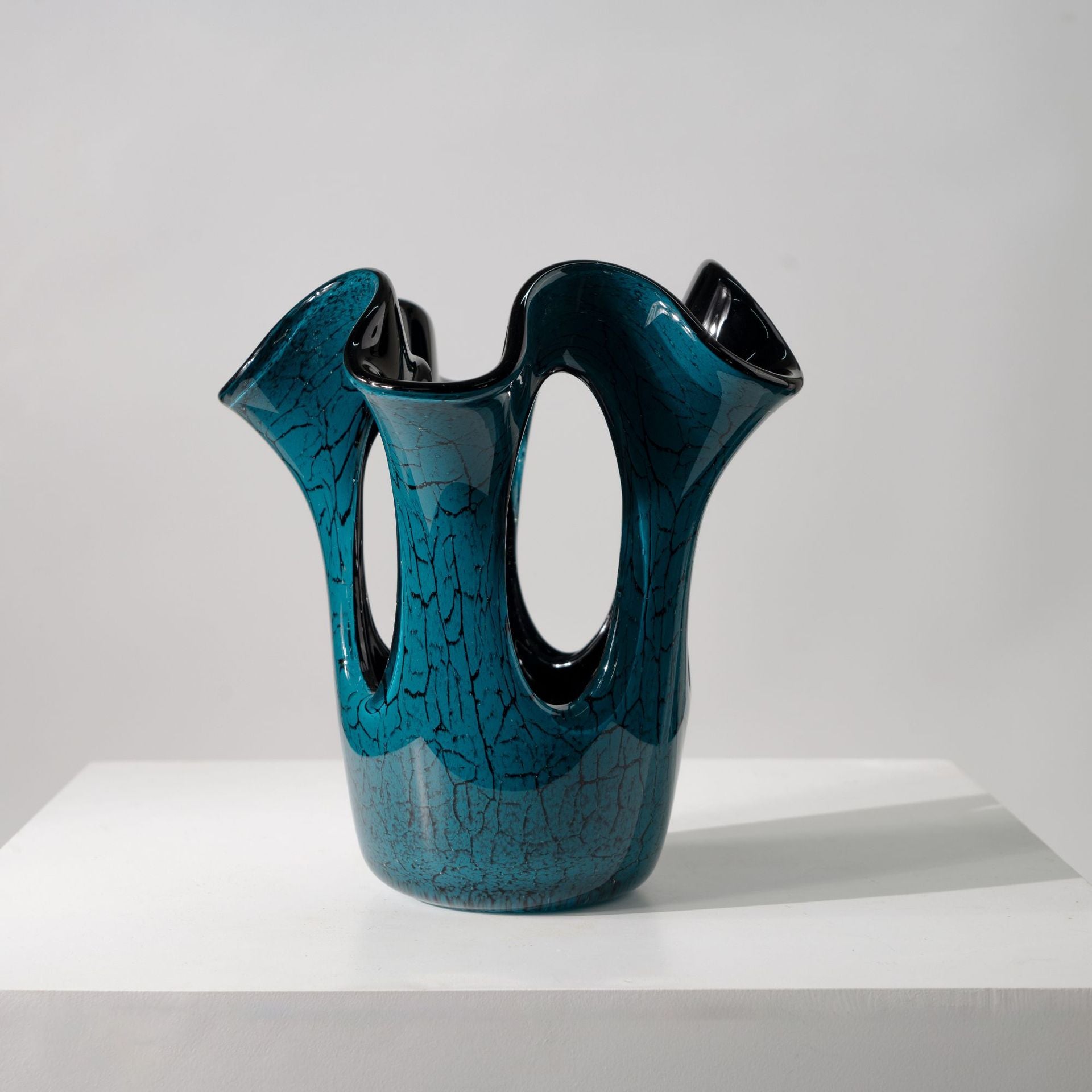 Teal crackle glass vase with wavy rim front view