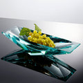 Teal crystal glass geometric centerpiece bowl styled with grapes