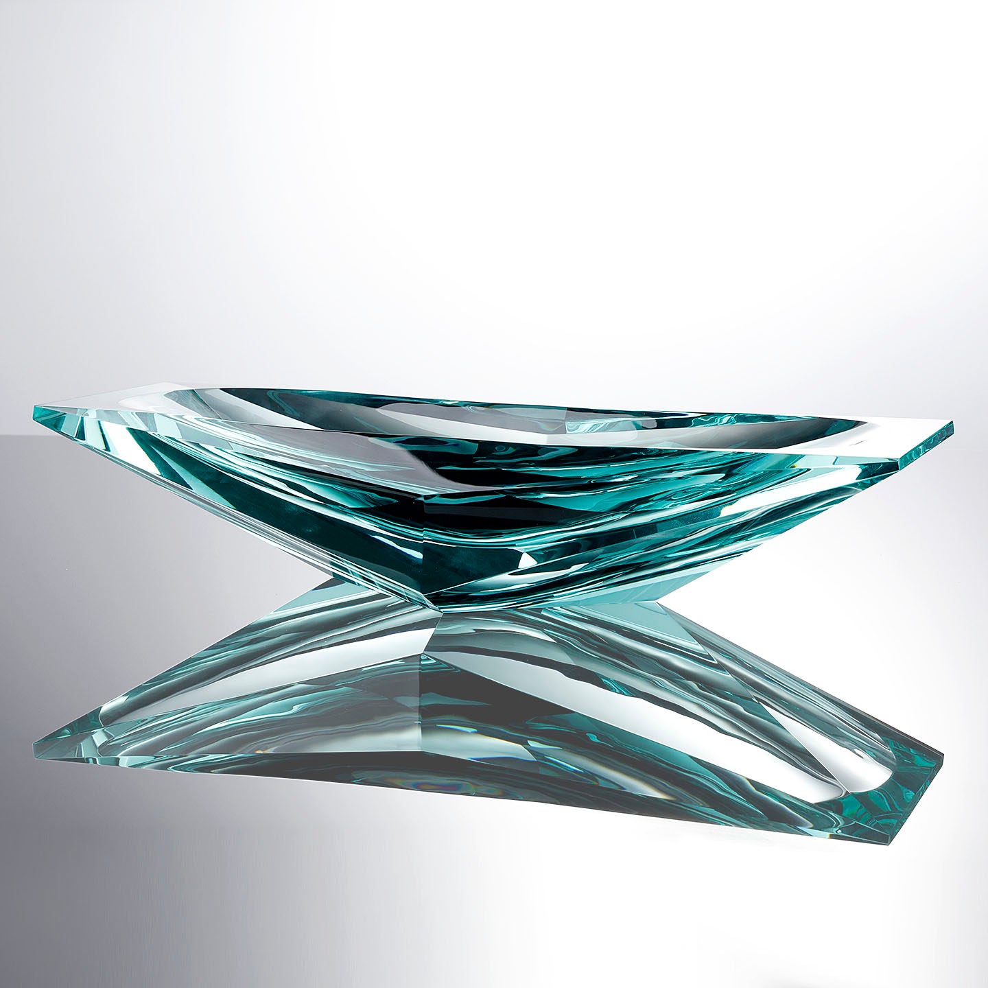 Side view of angular teal crystal glass bowl
