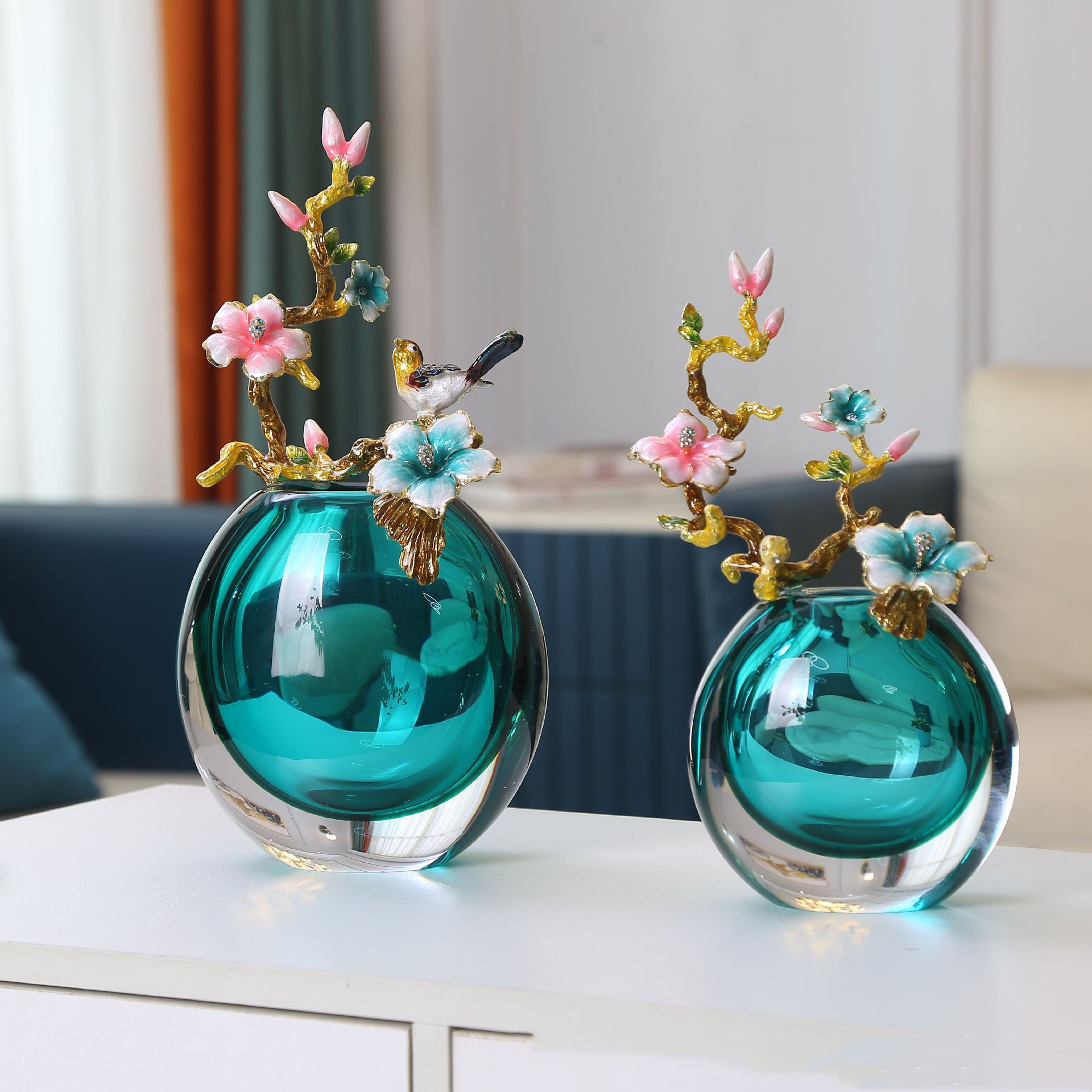Teal glass globe vase with gold enamel flower branch and bird