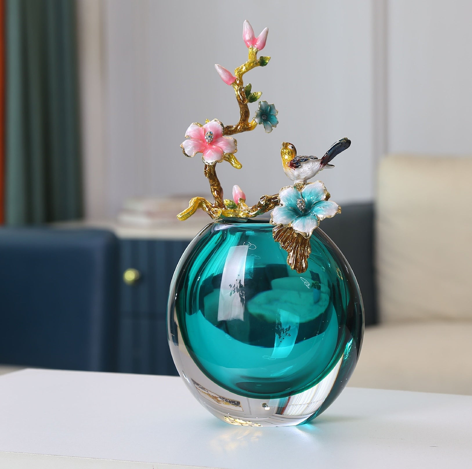 Front view of teal glass vase with intricate enamel detailing