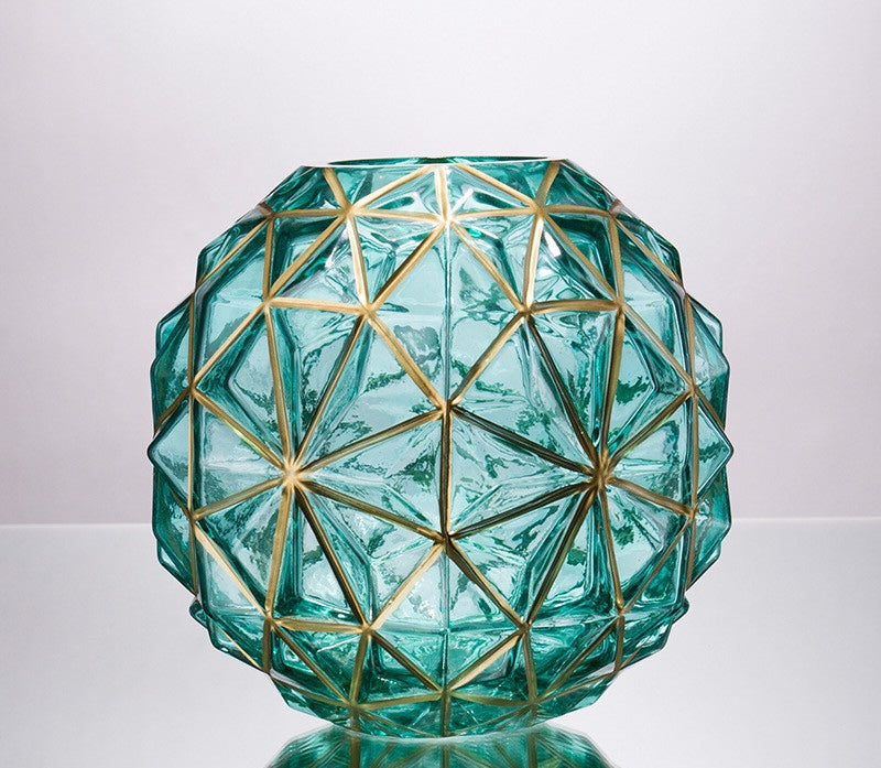 Round teal glass vase with gold geometric lines