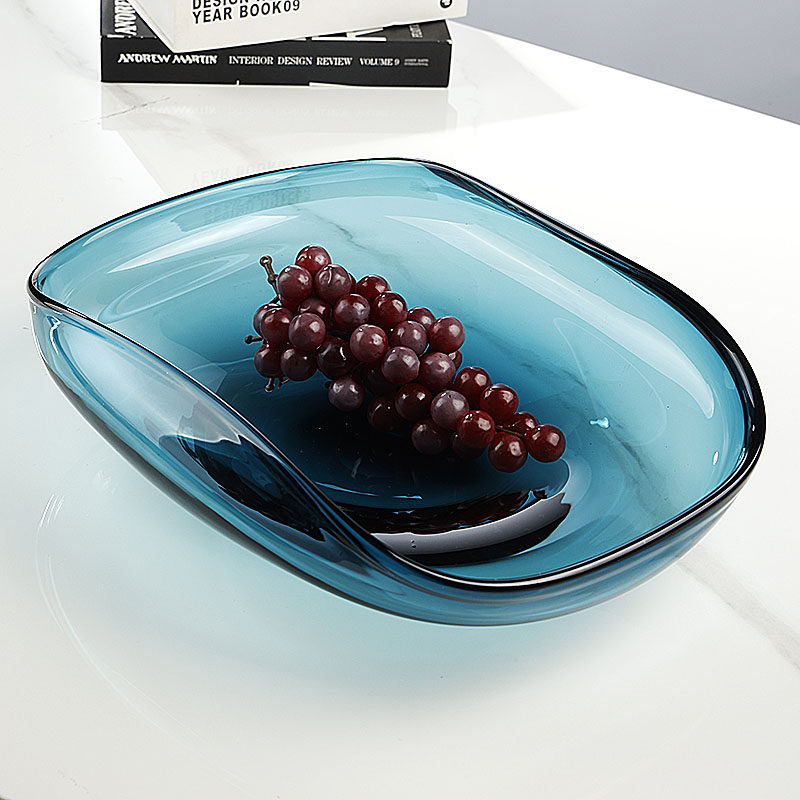 Angled view of teal glass bowl with grapes