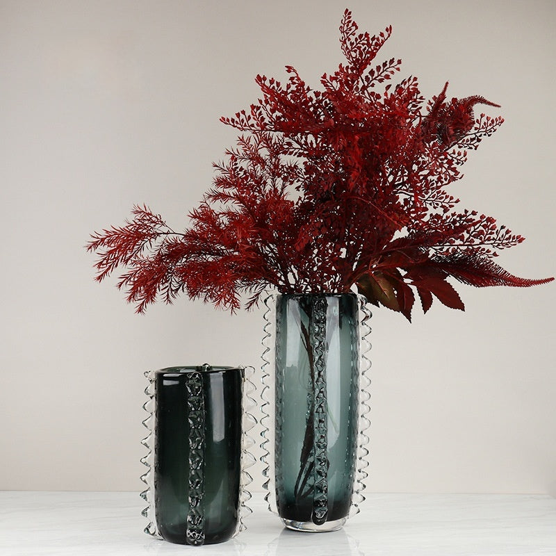 Teal glass scalloped cylinder vases with red botanical arrangement