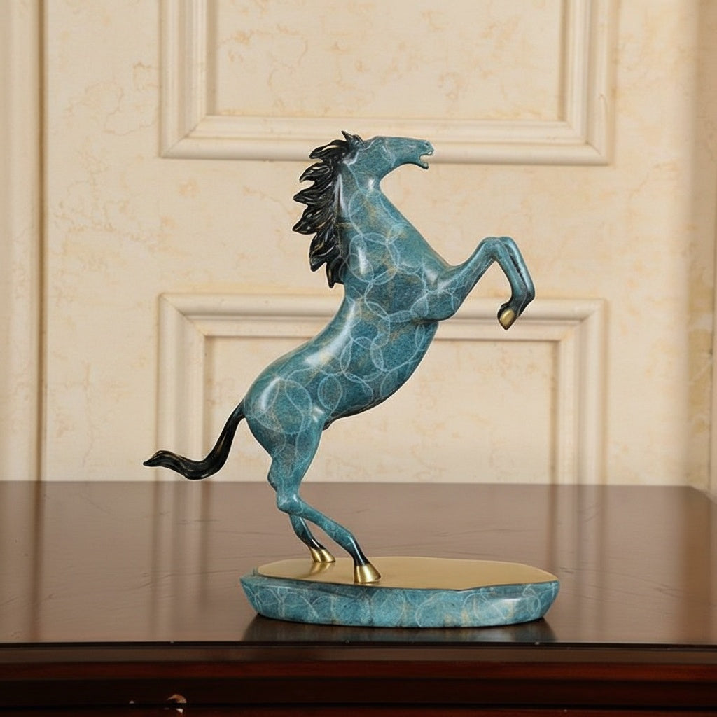 Side view of teal horse sculpture with gold mane rearing up