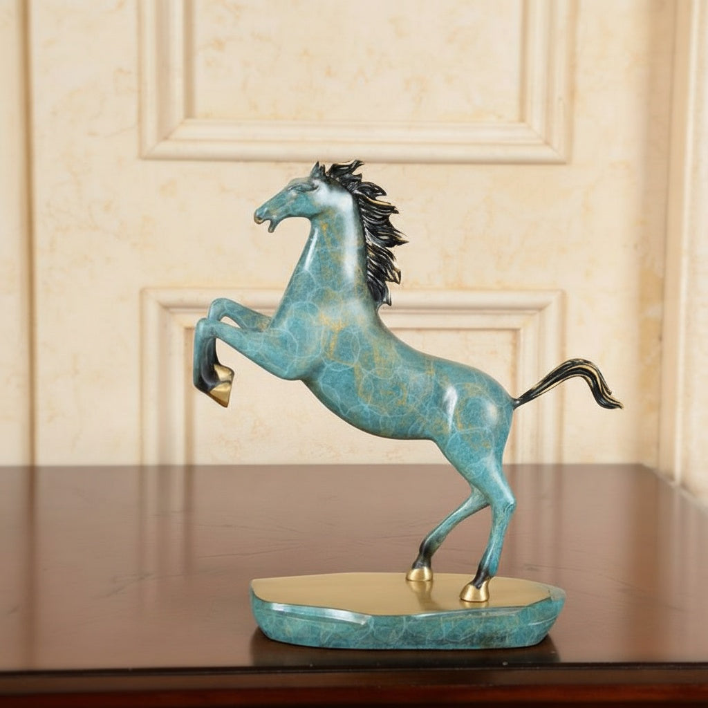Side view of turquoise horse figurine with gold accents