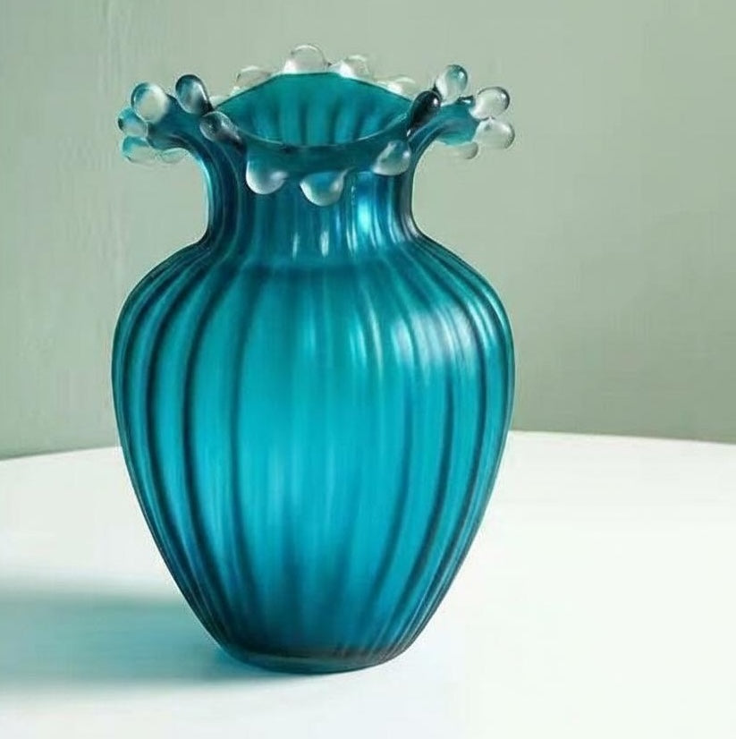 Angled view of teal fluted vase
