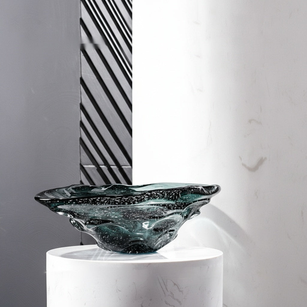 Side view of organic teal seeded glass bowl on pedestal