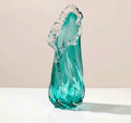Medium teal twisted glass vase with organic ruffled rim on white background