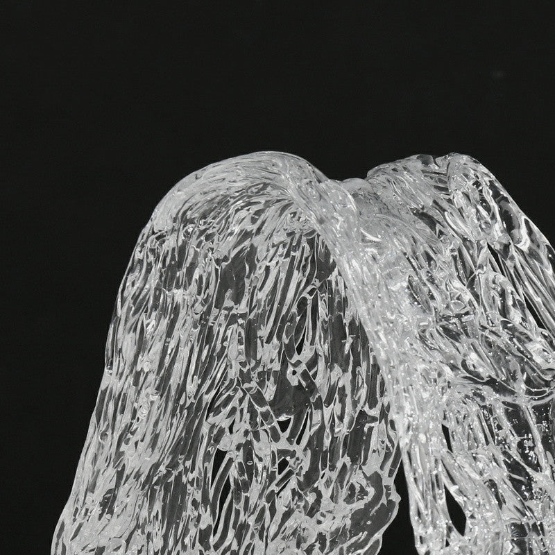 Close up detail of textured water-like surface on acrylic sculpture