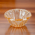 Textured amber glass scalloped serving bowl angle view