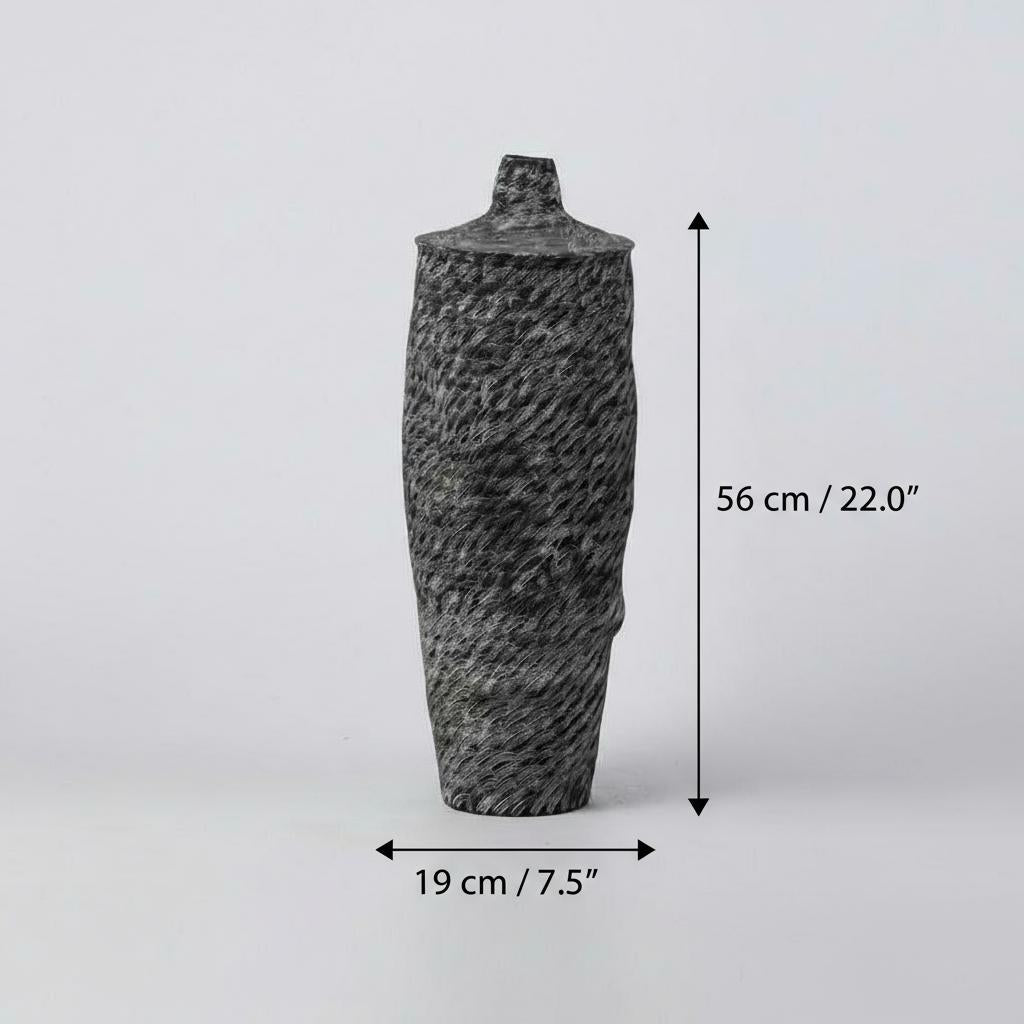 Tall black textured ceramic vase with organic rim