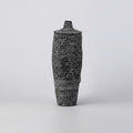 Medium bulbous black ceramic vase with hand-etched texture