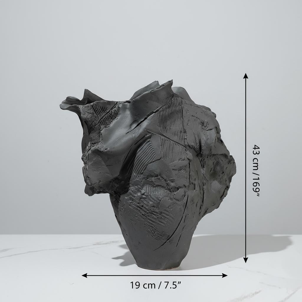 Dimensions of sculptural black vase showing height and width