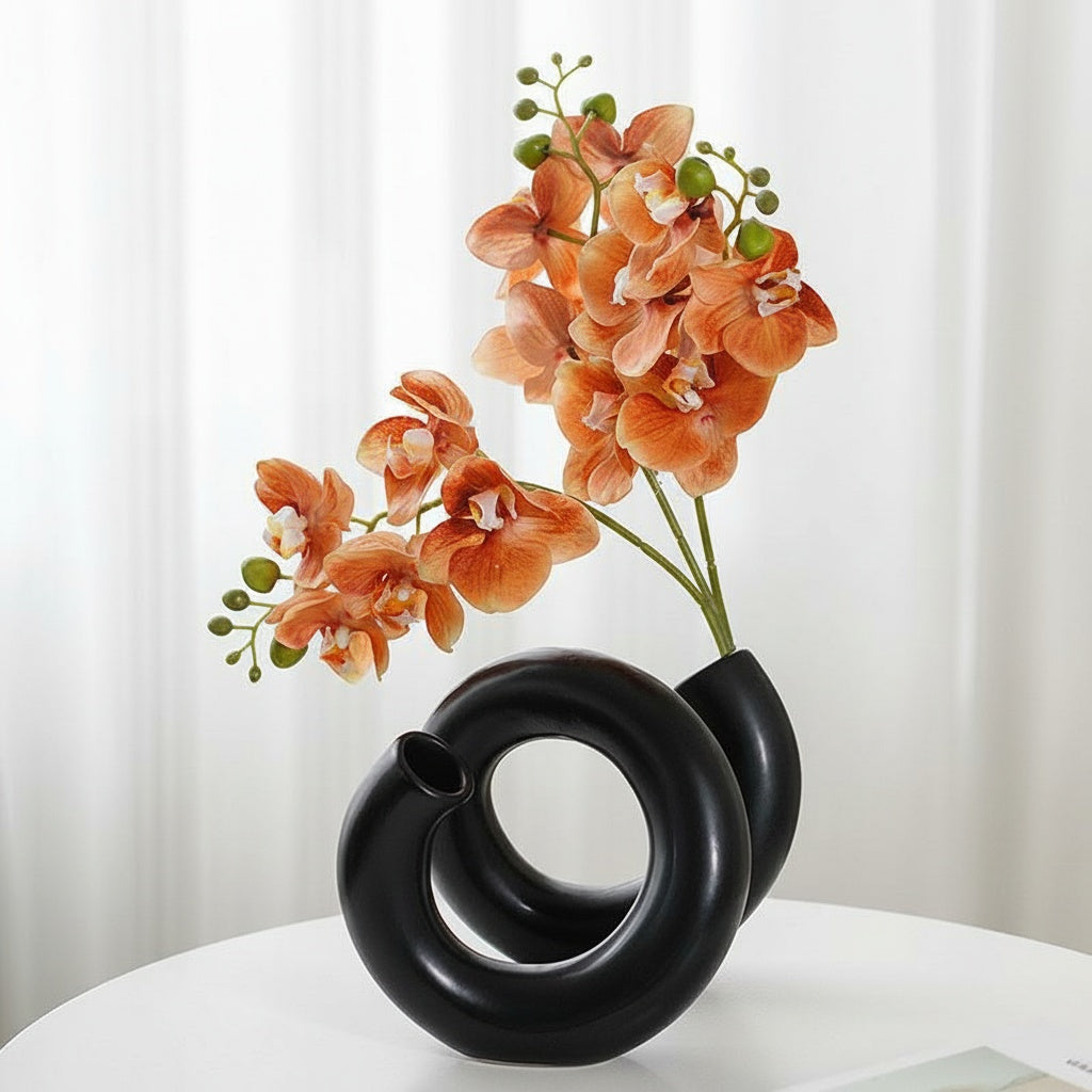 Textured Black Coiled Sculptural Vase with Orange Orchids
