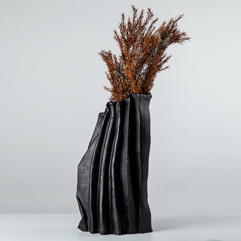 Textured black resin pleated vase with dried botanicals